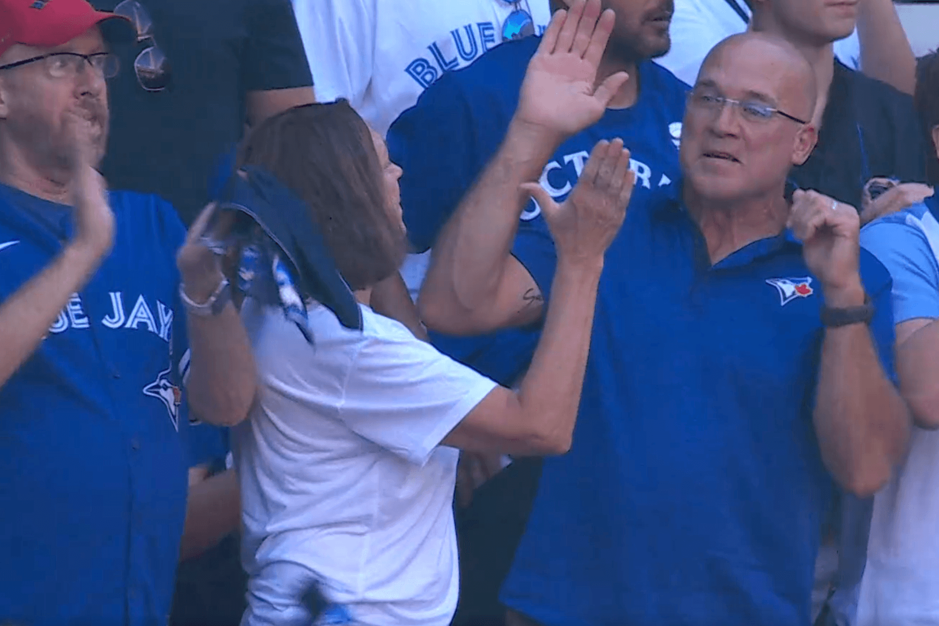 https://display.dailyhive.com/uploads/2025/10/yesavage-dad-high-five-blue-jays.png