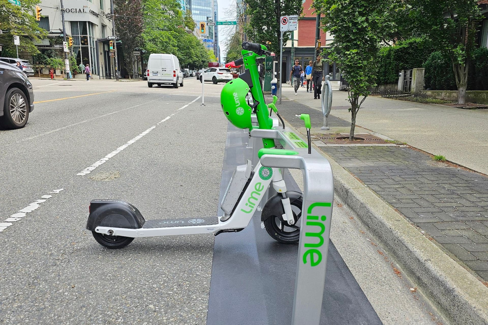https://images.dailyhive.com/20250611160154/lime-e-scooter-share-station-downtown-vancouver-f.jpg