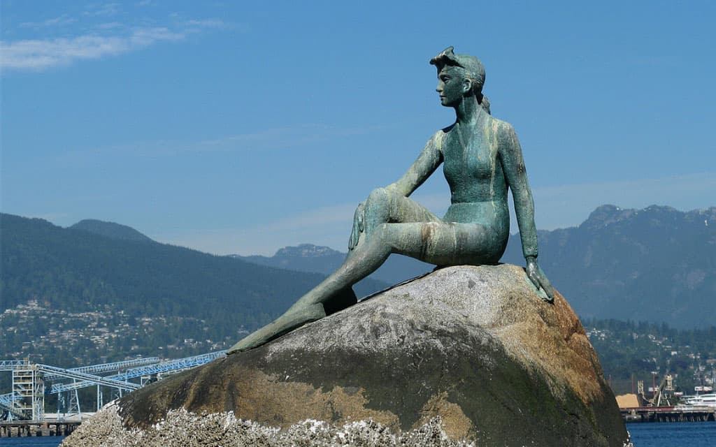 https://www.vancouverplanner.com/wp-content/uploads/2023/08/the-girl-in-a-wetsuit-in-vancouver-bc-canada.jpg